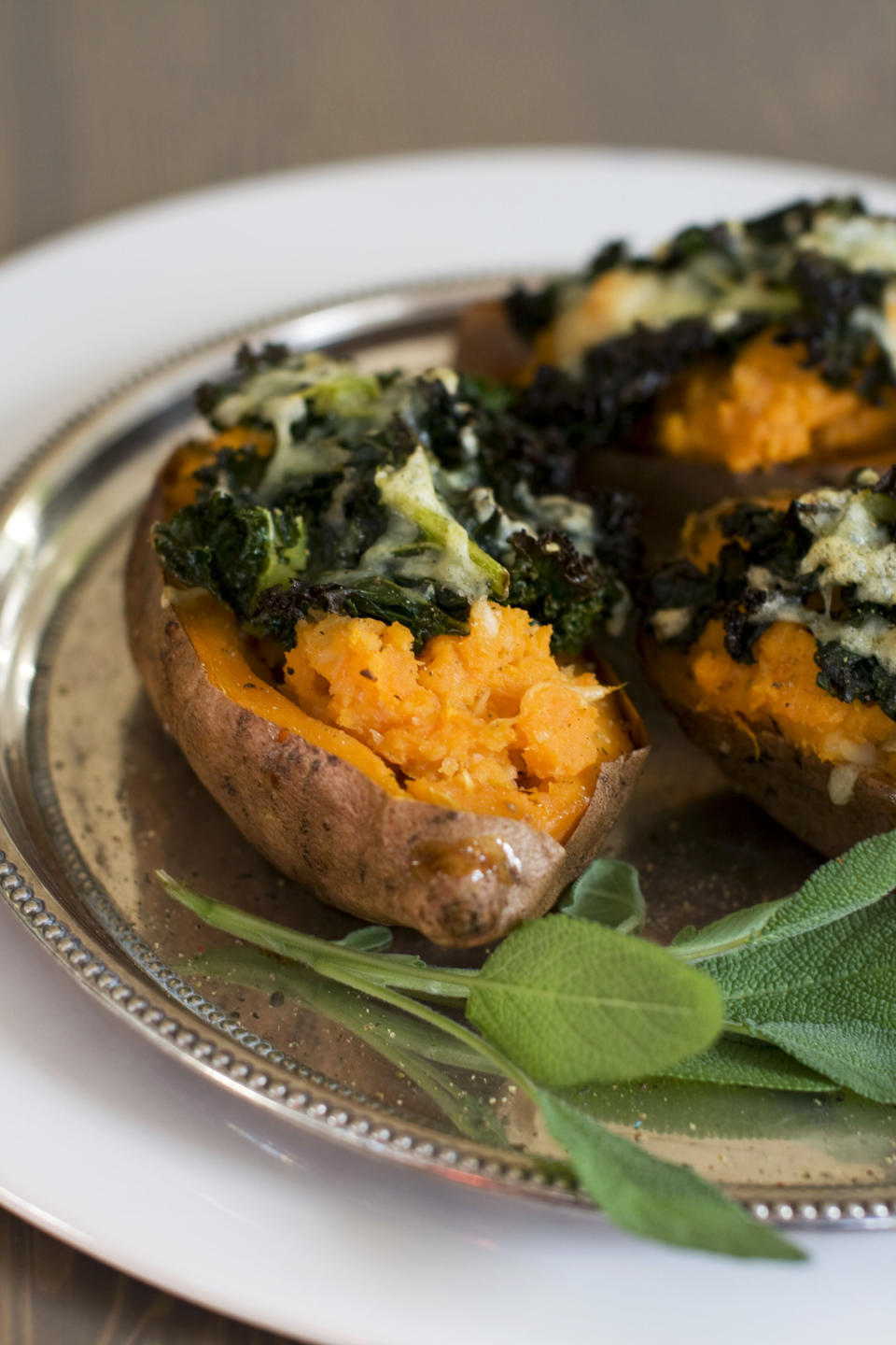 In this image taken on Dec. 3, 2012, loaded sweet potatoes with roasted garlic are shown served on a plate in Concord, N.H. (AP Photo/Matthew Mead)