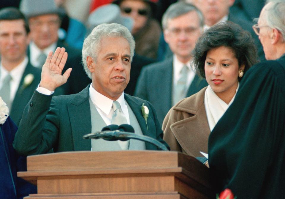 L. Douglas Wilder is sworn in as the 66th Governor of Virginia during a ceremony outside the Capitol in Richmond Saturday January 13, 1990. Wilder became the first elected black Governor of the United States. Former Governor Gerald Baliles is at right. (AP Photo/Ken Bennett)