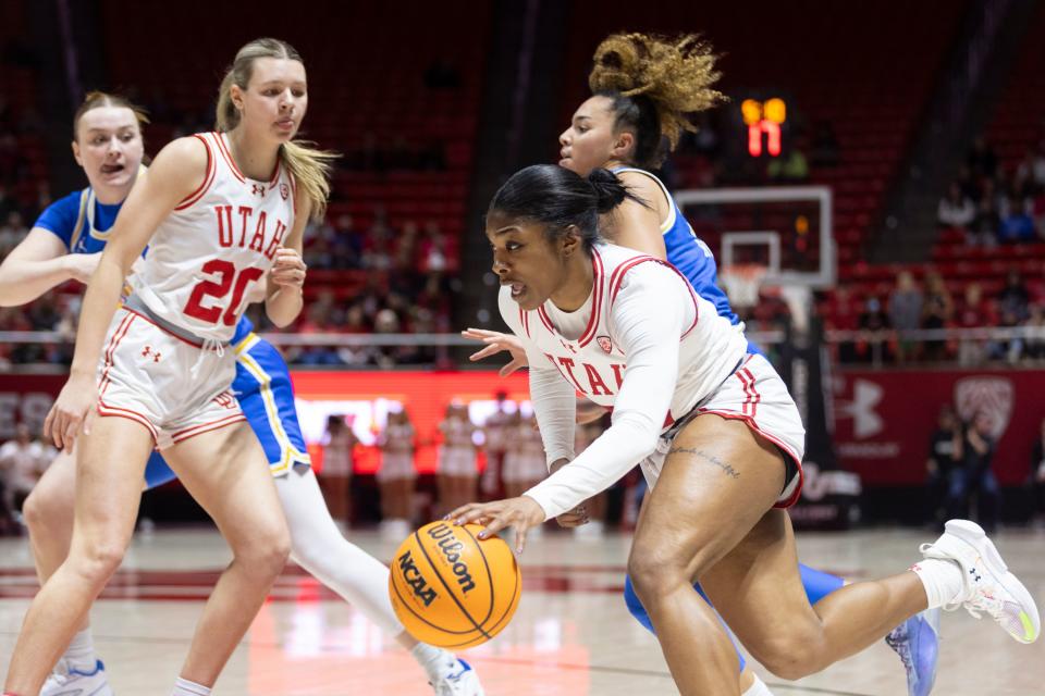 Utah’s Dasia Young, front right, dribbles towards the basket as the Utes play the UCLA Bruins at the Huntsman Center in Salt Lake City on Jan. 22, 2024.