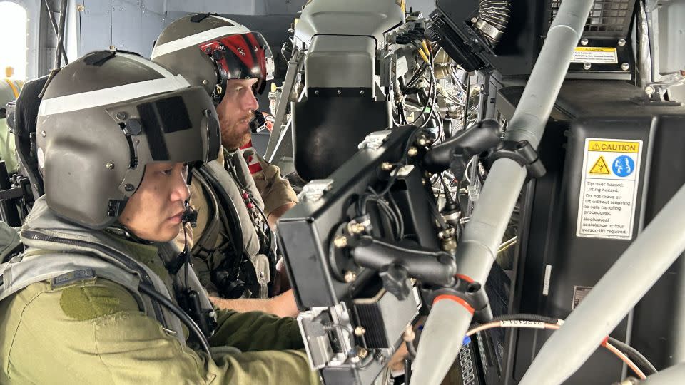 Radar operators scan their instruments in a Canadian antisubmarine warfare helicopter over the East China Sea. - Brad Lendon/CNN