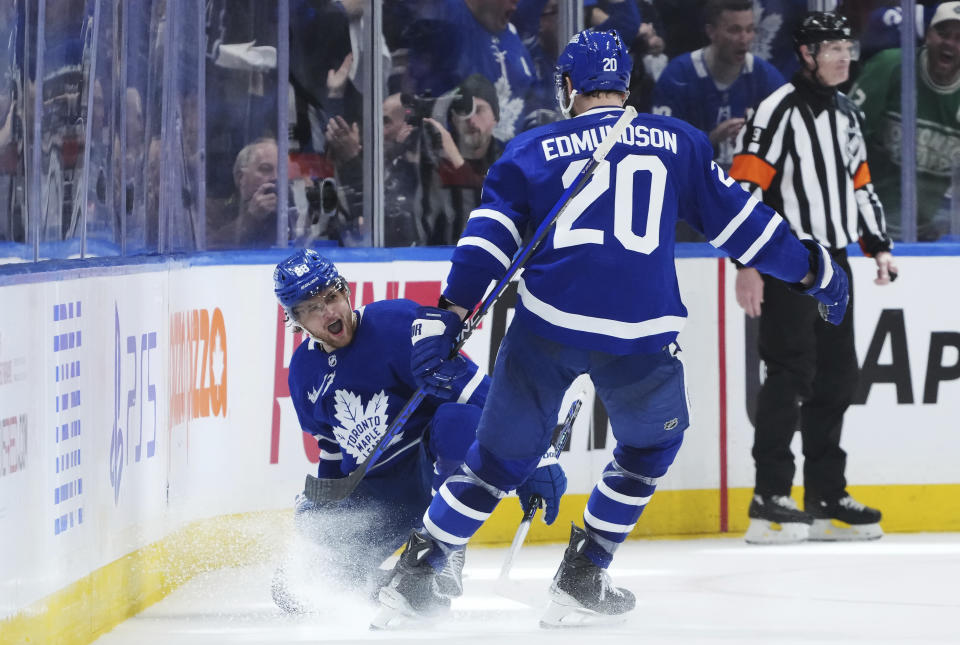 Toronto Maple Leafs' William Nylander (88) celebrates after his goal against the Boston Bruins with Joel Edmundson (20) during third-period action in Game 6 of an NHL hockey Stanley Cup first-round playoff series in Toronto, Thursday, May 2, 2024. (Nathan Denette/The Canadian Press via AP)