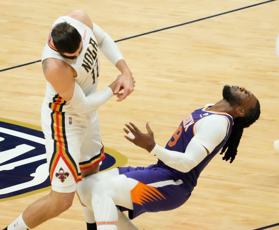 Apr 24, 2022; New Orleans, Louisiana, U.S.;  Phoenix Suns forward Jae Crowder (99) is fouled by New Orleans Pelicans center Jonas Valanciunas (17) during Game 4 of the Western Conference playoffs. Mandatory Credit: Michael Chow-Arizona Republic