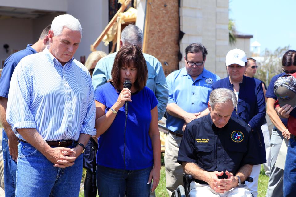 Vice President Mike Pence (left) listens as Karen Pence (middle) prays and Texas Governor Greg Abbott (right) bows his head at the First Baptist Rockport.