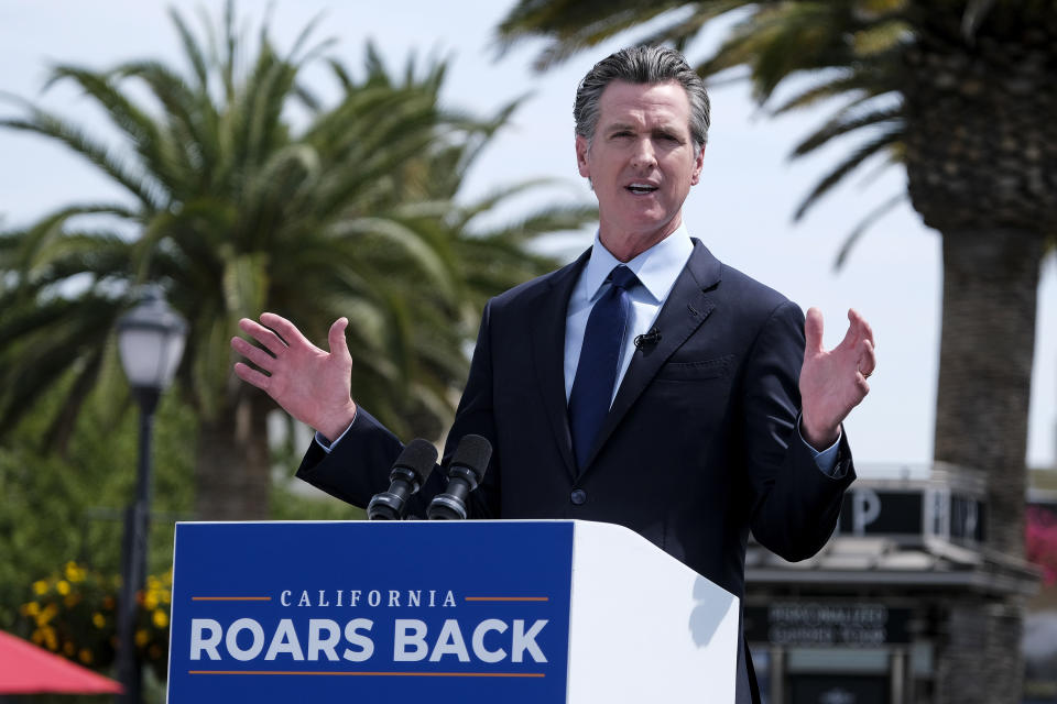 California Governor Gavin Newsom talks during a news conference at Universal Studios in Universal City, Calif., on Tuesday, June 15, 2021. Starting Tuesday, there were no more state rules on social distancing, and no more limits on capacity at restaurants, bars, supermarkets, gyms, stadiums or anywhere else. (AP Photo/Ringo H.W. Chiu)