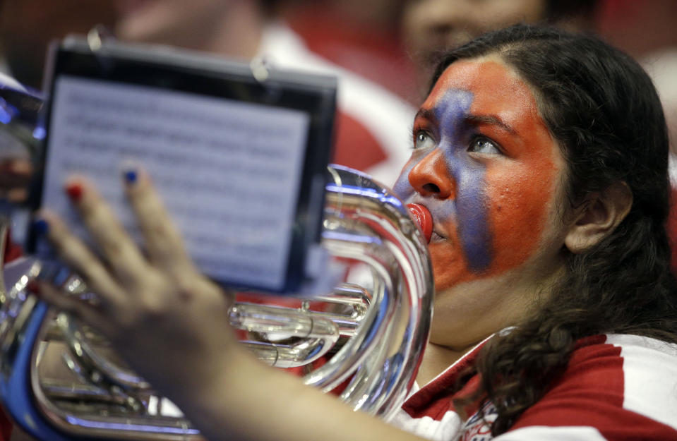 A member of the Arizona band plays before a regional final NCAA college basketball tournament game against Wisconsin, Saturday, March 29, 2014, in Anaheim, Calif. (AP Photo/Jae C. Hong)