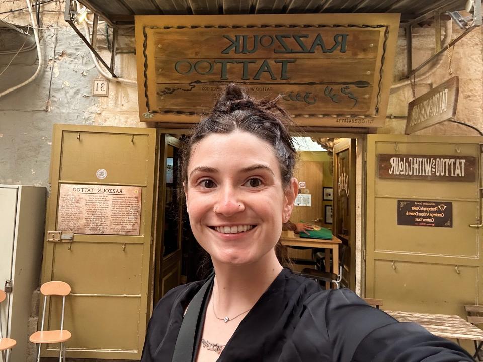 The author taking a selfie outside Razzouk Tattoo in Jerusalem.