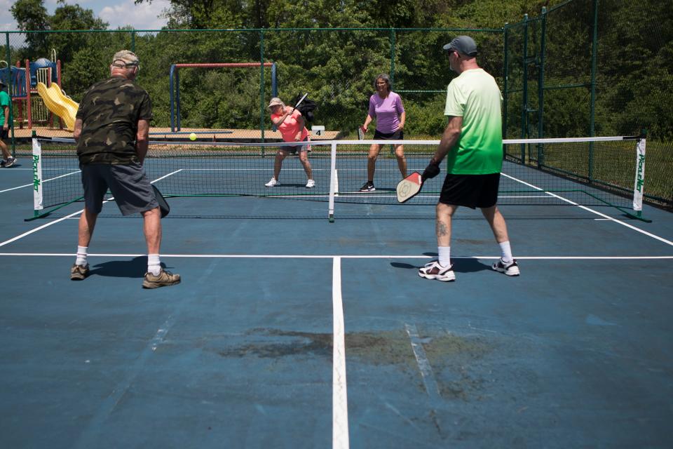 People play pickle ball at Deacons Walk Park Tuesday, May 17, 2022. 