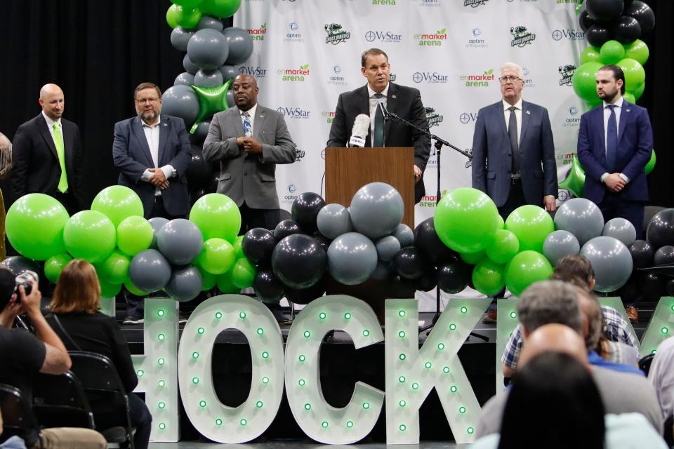 The Ghost Pirates' new head coach Rick Bennett, at the podium, speaks during the event to announce his hiring as well as the NHL and AHL team affiliations at Enmarket Arena on May 19, 2022. From left: Ghost Pirates CEO and majority owner Andy Kaufmann, team president Bob Ohrablo, Savannah Mayor Van Johnson, Bennett, Henderson Silver Kings general manager Tim Speltz and Vegas Golden Knights director of hockey legal affairs Andrew Lugerner.