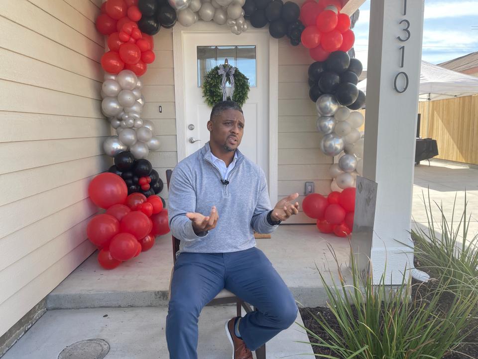 Former NFL running back Warrick Dunn celebrated presenting his 200th fully furnished home to Fellicia Miller and her son, Raymond Mouton, in Los Angeles just miles from where Super Bowl 56 is set to happen Sunday.