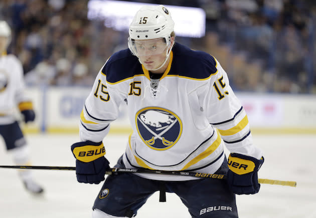 FILE - In this Nov. 10, 2015, file photo, Buffalo Sabres center Jack Eichel (15) gets ready for a faceoff against the Tampa Bay Lightning during the third period of an NHL hockey game in Tampa, Fla. Eichel was helped off the ice after hurting his left leg during practice on Wednesday, Oct. 12, 2016. he was in front of the net when he got tangled up with a defensemen and his leg buckled beneath him. The injury occurred a day before the Sabres open the season hosting the Montreal Canadiens. (AP Photo/Chris O'Meara, File)