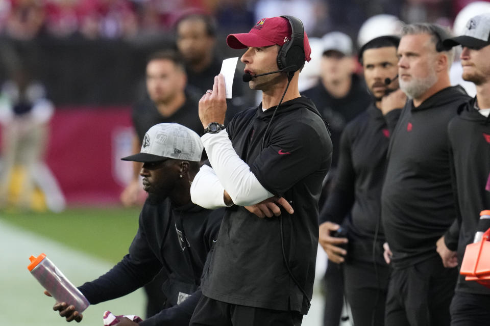 Arizona Cardinals head coach Jonathan Gannon, middle, stands on the sideline during the second half of an NFL football game against the San Francisco 49ers Sunday, Dec. 17, 2023, in Glendale, Ariz. (AP Photo/Ross D. Franklin)