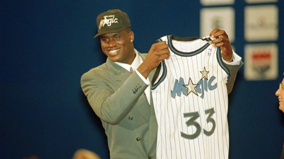 A happy Shaquille O’Neal, from Louisiana State University, holds up his Orlando Magic jersey after he was the first pick at the NBA draft at Memorial Coliseum in Portland, Ore., June 24, 1992. (AP Photo/Don Ryan)