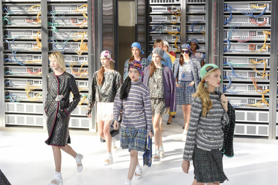 Models had their hair styled in side ponytails secured by Chanel hair ties and wore baseball caps in funky prints. 
