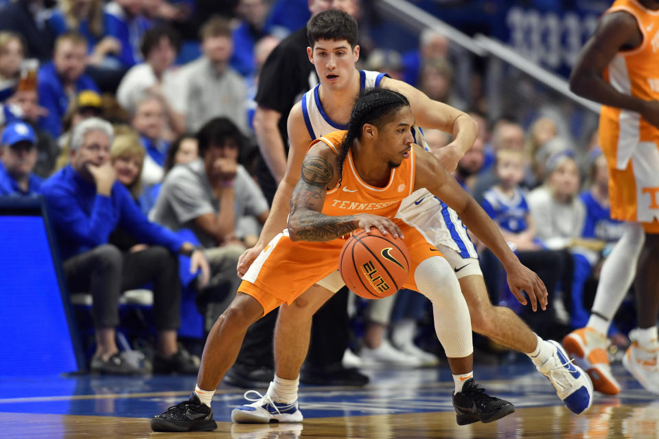 Tennessee guard Zakai Zeigler (5) turns to drive under Kentucky guard Reed Sheppard (15) during the second half of an NCAA college basketball game in Lexington, Ky., Saturday, Feb. 3, 2024. Tennessee won 103-92. (AP Photo/Timothy D. Easley)