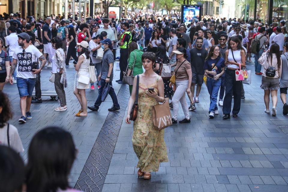 SYDNEY, AUSTRALIA - DECEMBER 26: Shoppers flock to Pitt Street Mall during Boxing Day sales on December 26, 2022 in Sydney, Australia. Retailers offer massive discounts and enticing deals on the boxing day public holiday in Australia, attracting many shoppers who are keen to take advantage of bargains once Christmas is over. (Photo by Roni Bintang/Getty Images)