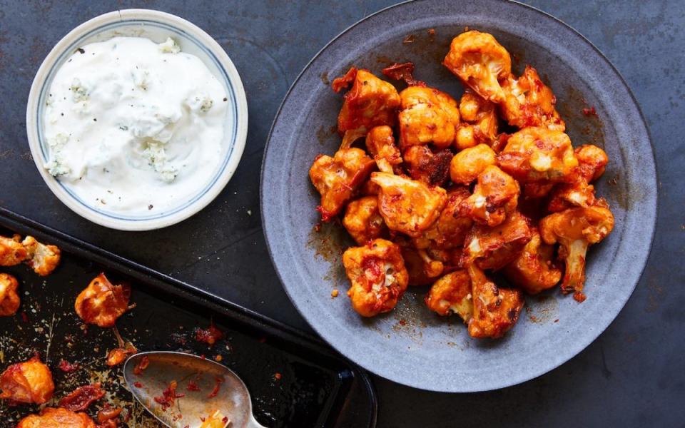 <p>Nicole Franzen</p><p>This plant-based <strong>Buffalo Cauliflower</strong> snack uses baked <a href="https://www.yahoo.com/lifestyle/51-cauliflower-recipes-constantly-crave-210338531.html" data-ylk="slk:cauliflower;elm:context_link;itc:0;sec:content-canvas;outcm:mb_qualified_link;_E:mb_qualified_link;ct:story;" class="link  yahoo-link">cauliflower</a> instead of chicken and the North African <a href="https://www.yahoo.com/lifestyle/20-hottest-hot-sauces-world-084416638.html" data-ylk="slk:hot sauce;elm:context_link;itc:0;sec:content-canvas;outcm:mb_qualified_link;_E:mb_qualified_link;ct:story;" class="link  yahoo-link">hot sauce</a> <a href="https://parade.com/1125852/felicialim/harissa-recipes/" rel="nofollow noopener" target="_blank" data-ylk="slk:harissa;elm:context_link;itc:0;sec:content-canvas" class="link ">harissa</a> instead of <a href="https://www.yahoo.com/lifestyle/20-hottest-hot-sauces-world-084416638.html" data-ylk="slk:traditional wing sauce;elm:context_link;itc:0;sec:content-canvas;outcm:mb_qualified_link;_E:mb_qualified_link;ct:story;" class="link  yahoo-link">traditional wing sauce</a>. </p><p><strong>Get the recipe: <a href="https://parade.com/855349/parade/buffalo-cauliflower/" rel="nofollow noopener" target="_blank" data-ylk="slk:Buffalo Cauliflower;elm:context_link;itc:0;sec:content-canvas" class="link ">Buffalo Cauliflower</a></strong></p>