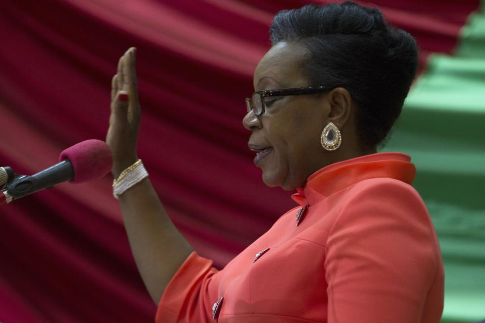 Newly parliamentary-elected interim President of the Central African Republic Samba-Panza swears an oath during her swearing-in ceremony at the National Assembly in the capital Bangui