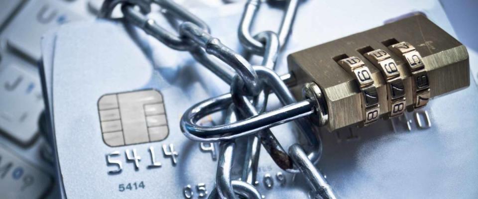 chained credit cards security lock with password - phishing protection concept