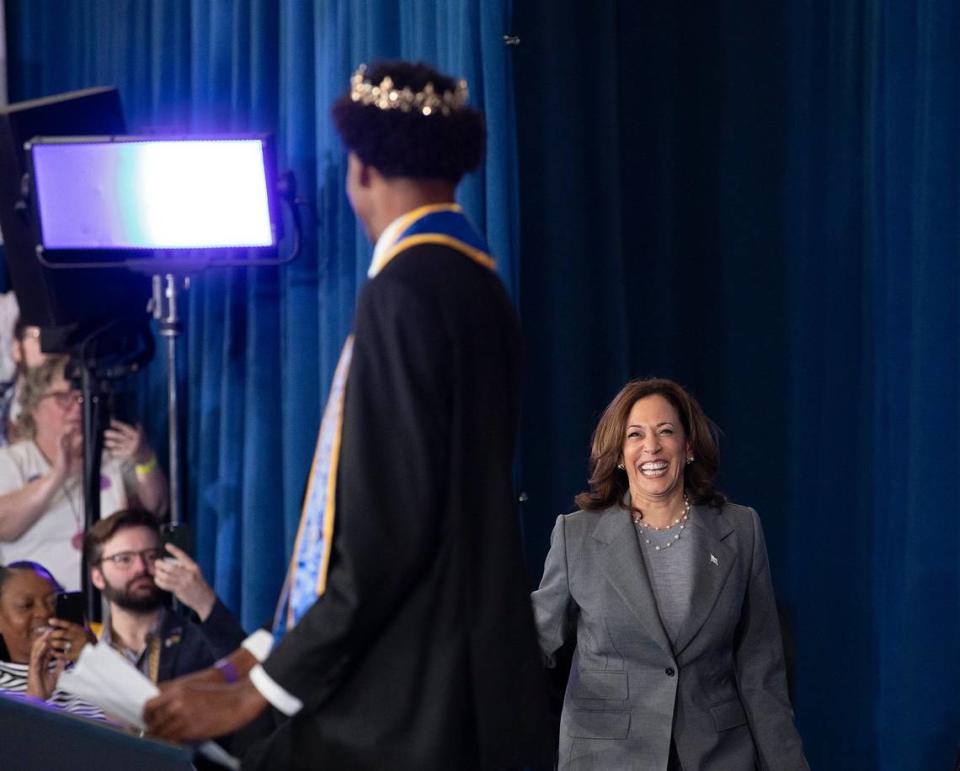 Vice President Kamala Harris smiles as she is introduced by Devin Mims, a James B. Dudley High School student who serves as Mister Dudley High, during a campaign event at the school on Thursday, July 11, 2024, in Greensboro, N.C.