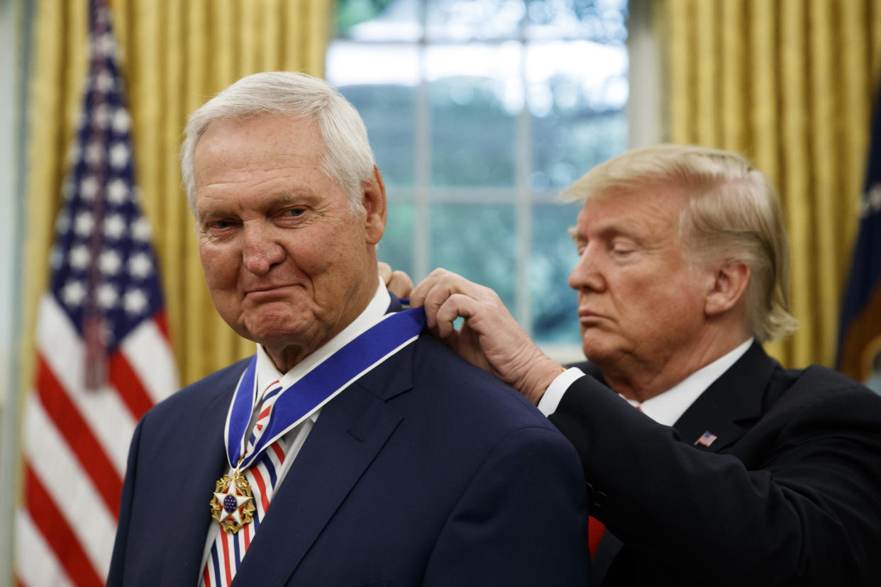 President Donald Trump, right, presents the Presidential Medal of Freedom to NBA legend Jerry West in the Oval Office of the White House on Thursday.