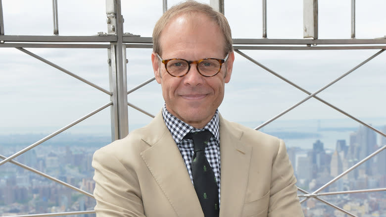 Alton Brown smiling New York skyline