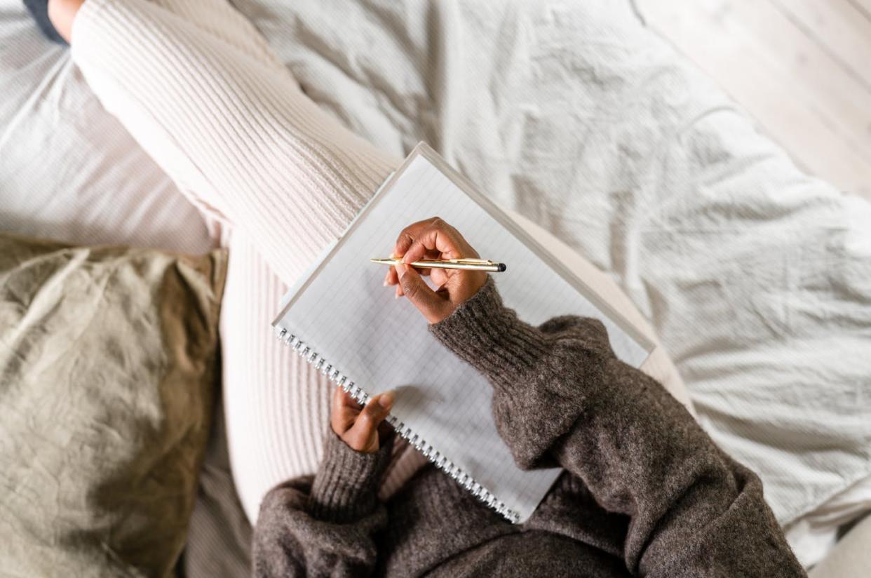 Handwritten diaries and digital diaries both help preserve experiences and memories, but in different ways. <a href="https://www.gettyimages.com/detail/photo/woman-writing-in-bed-royalty-free-image/1341823785" rel="nofollow noopener" target="_blank" data-ylk="slk:luza studios/E+ via Getty Images;elm:context_link;itc:0;sec:content-canvas" class="link ">luza studios/E+ via Getty Images</a>