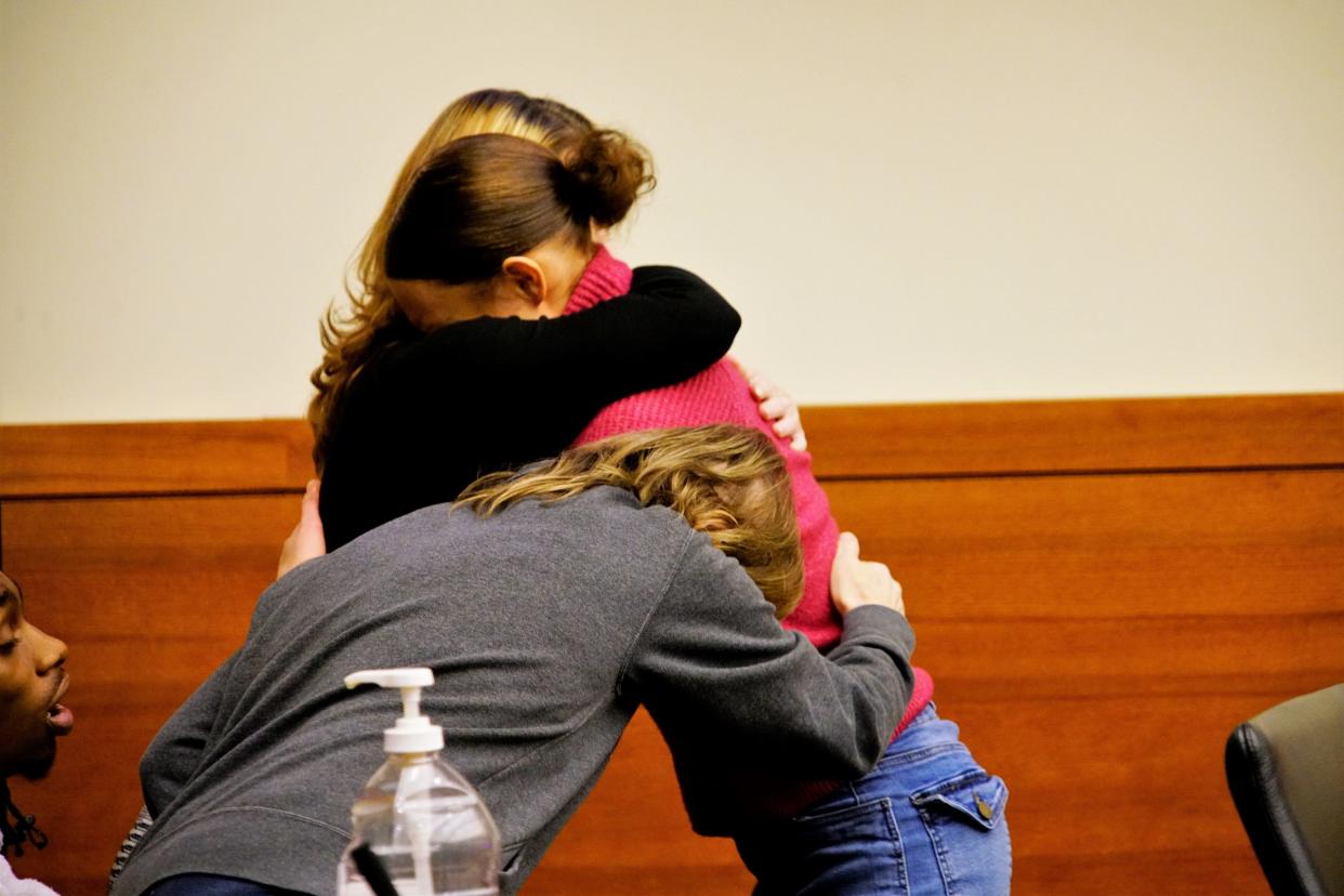 Marizah Thomas, 19, hugs her family on Tuesday, Jan. 23, 2024, after a Franklin County Common Pleas Court jury acquitted Thomas of aggravated murder and murder for fatally shooting 17-year-old Jayce O'Neal in July 2021. Thomas had argued she shot O'Neal in self-defense after a brief fight between the two outside Thomas' home.