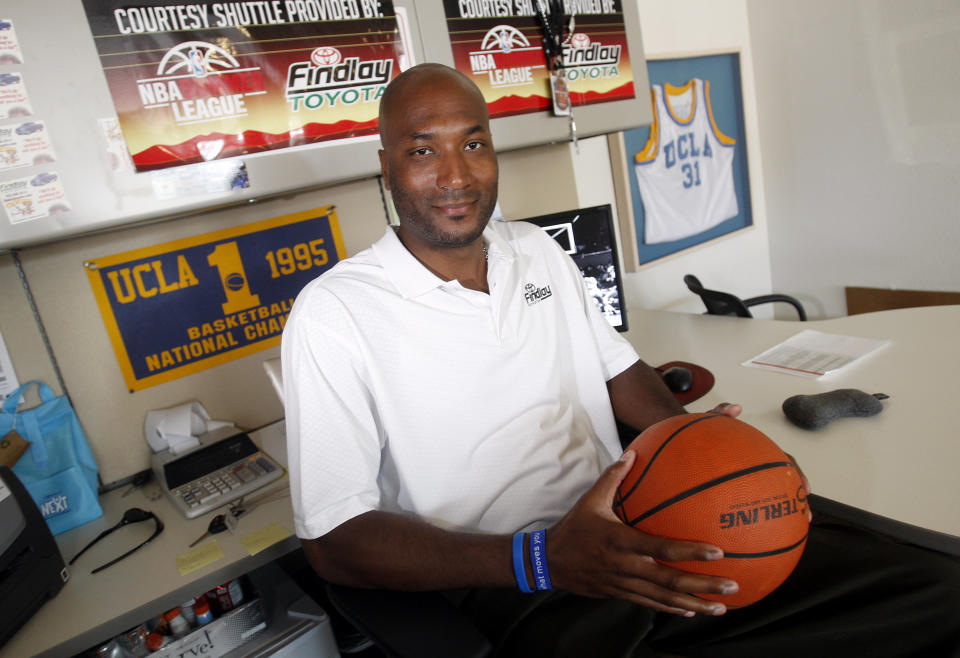 FILE - In this Sept. 18, 2010, file photo, former UCLA basketball player Ed O'Bannon Jr. sits in his office in Henderson, Nev. NIL's blossoming started with a seed: a 2009 class-action lawsuit filed by former UCLA basketball player Ed O'Bannon that argued the NCAA should not be allowed to use the likeness of football and men's basketball players — past and present — to make money. (AP Photo/Isaac Brekken, File)