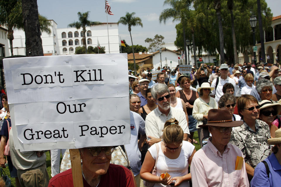 REMOVES REFERENCE TO BILLIONAIRE FILE - Members of the community fill De La Guerra Plaza in front of the Santa Barbara News-Press newspaper's office during a rally on July 18, 2006, in Santa Barbara, Calif. The Pulitzer Prize-winning Santa Barbara News-Press, one of California's oldest newspapers, has ceased publishing after its owner declared the 150-year-old publication bankrupt. After floundering for years, the newspaper became an online-only publication in April but its last digital edition was posted Friday, July 21, 2023, when owner Wendy McCaw filed for bankruptcy. (AP Photo/Michael A. Mariant, File)