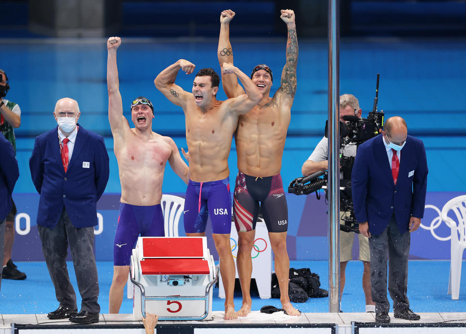 <p>Team USA's Bowen Becker, Blake Pieroni and Caeleb Dressel win gold in the Men's 4 x 100m Freestyle Relay Final at Tokyo Aquatics Centre on July 26.</p>