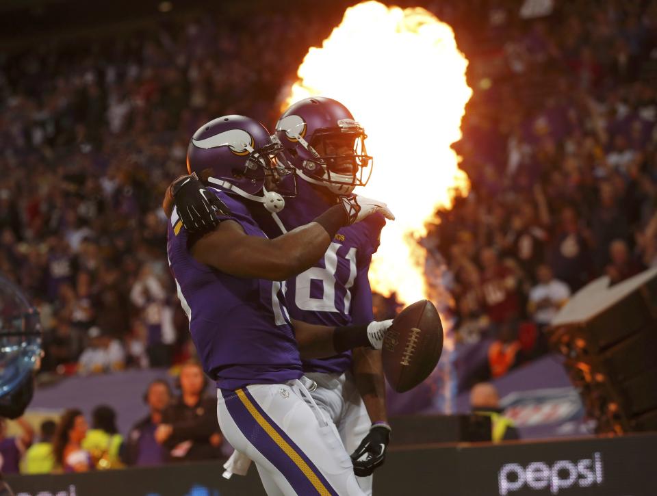 Minnesota Vikings wide receiver Jennings celebrates his first quarter touchdown with teammate Simpson as they met the Pittsburgh Steelers in their NFL football game at Wembley Stadium in London