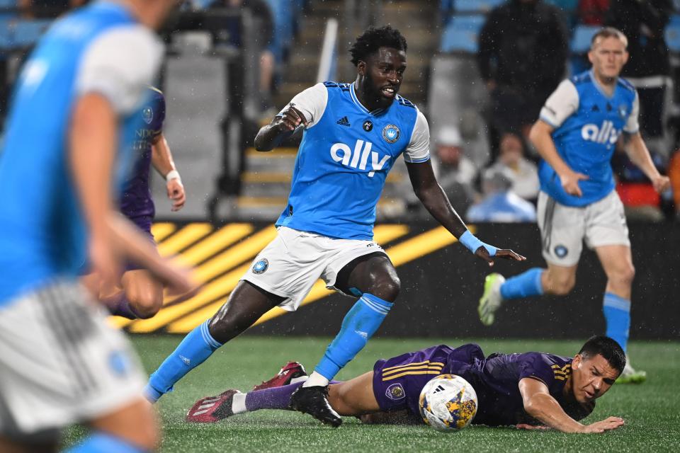 Aug 30, 2023; Charlotte, North Carolina, USA; Charlotte FC midfielder Derrick Jones (20) with the ball as Orlando City midfielder César Araújo (5) defends in the second half at Bank of America Stadium. Mandatory Credit: Bob Donnan-USA TODAY Sports