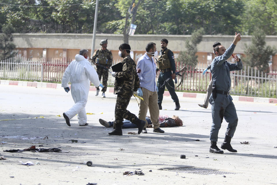 <p>A victim lies on the ground after the second blast in Kabul, Afghanistan, April 30, 2018. (Photo: Rahmat Gul/AP) </p>