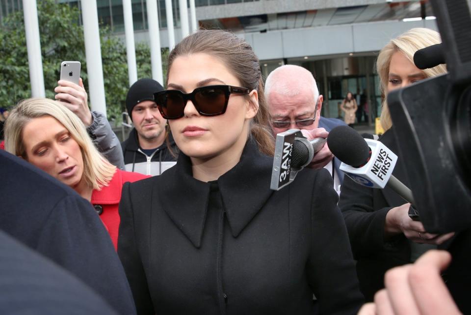 Belle Gibson makes a court appearance as she’s fined thousands of dollars (David Crosling / ITV / AAP)