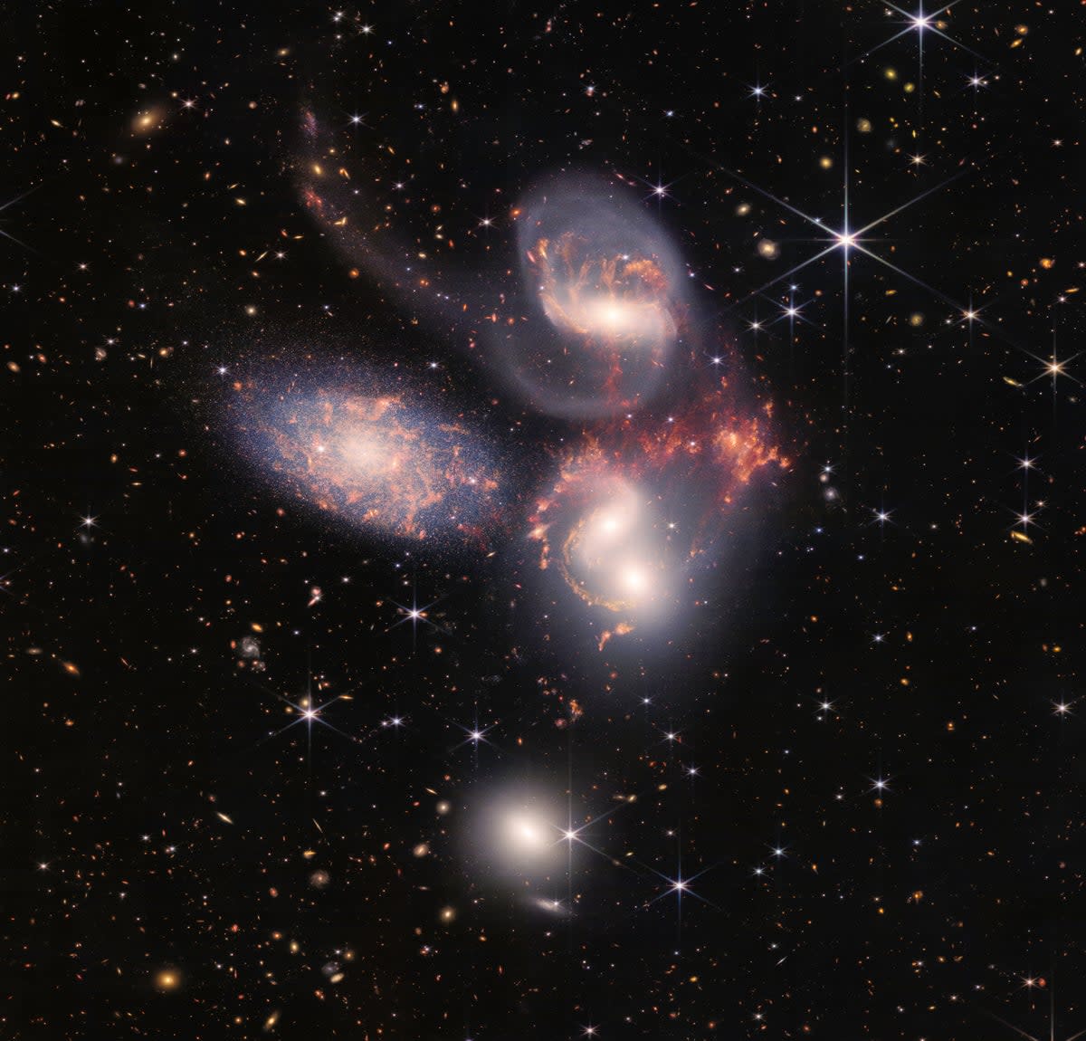 Stefan’s Quintet, a visual collection of five distant galaxies, was one of the Webb Telescope’s first full-colour images (Nasa)