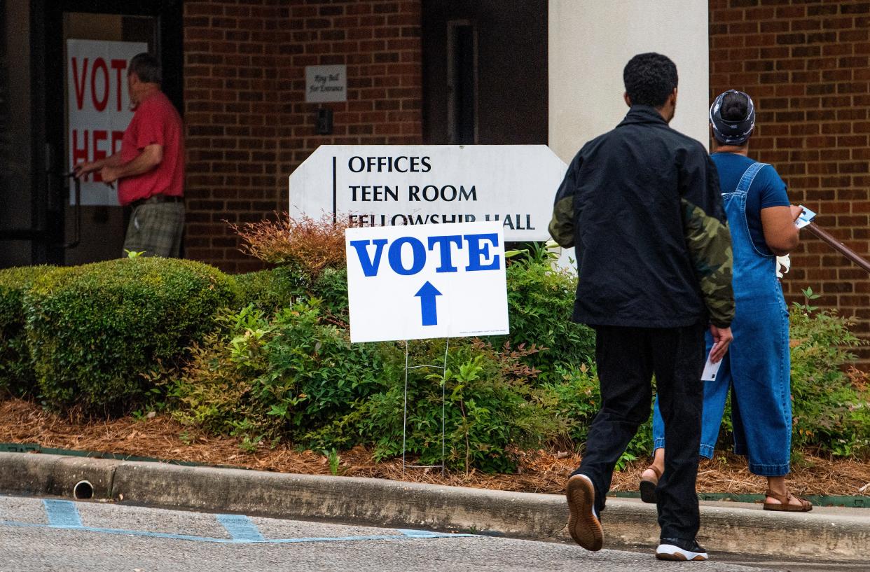 Voters arrive to vote at the Dalraida Church of Christ polling Place in Montgomery, Ala., on primary Election Day, Tuesday May 24, 2022. 