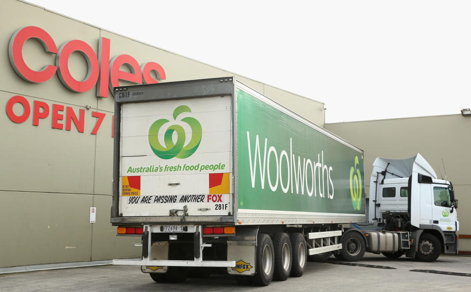 Woolworths truck in front of Coles sign. Source: Getty Images