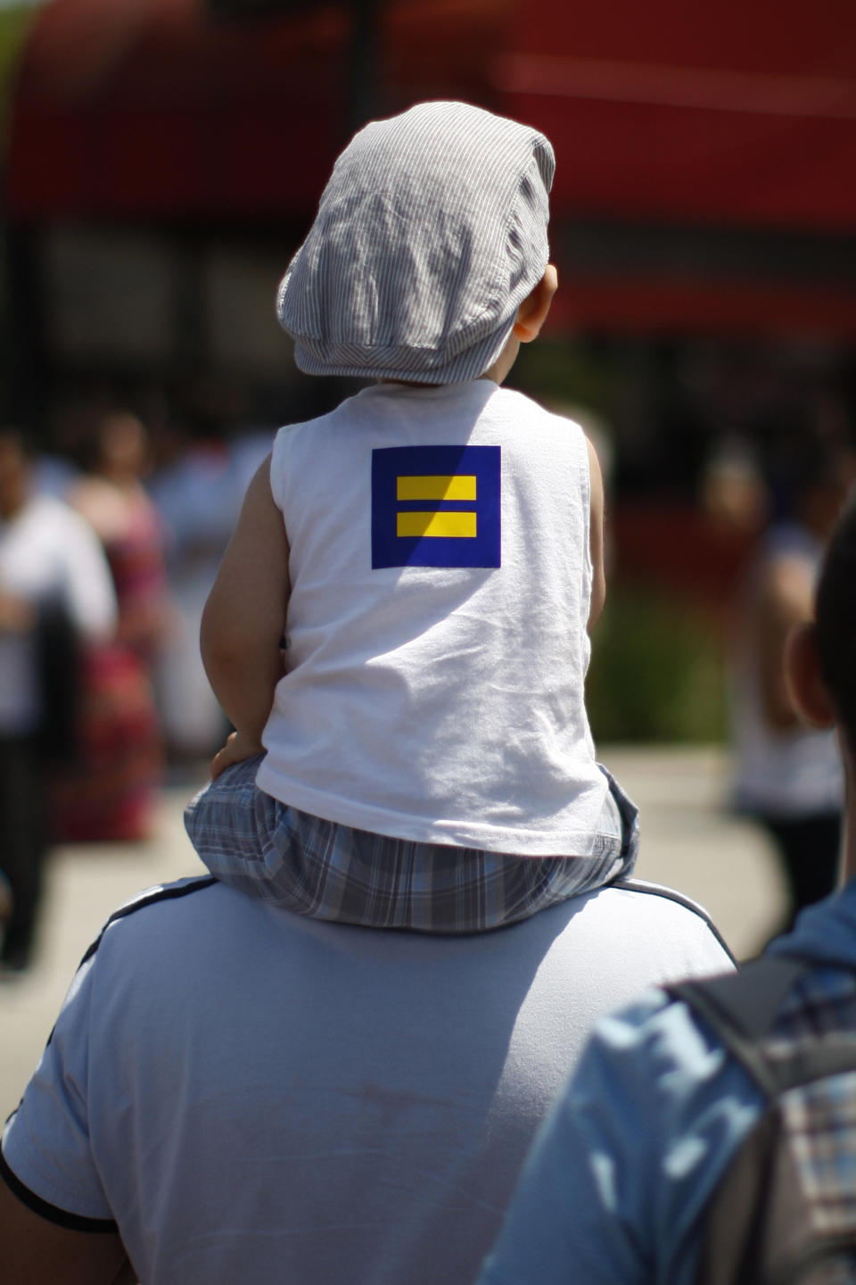 A child wears a Human Rights Campaign logo at the 43rd L.A. Pride parade on June 9, 2013 in West Hollywood, California. (Photo by David McNew/Getty Images)