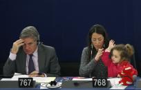 RNPS - PICTURES OF THE YEAR 2013 - Italy's Member of the European Parliament Licia Ronzulli (C) takes part with her daughter Vittoria in a voting session at the European Parliament in Strasbourg November 19, 2013. REUTERS/Vincent Kessler (FRANCE - Tags: POLITICS TPX)