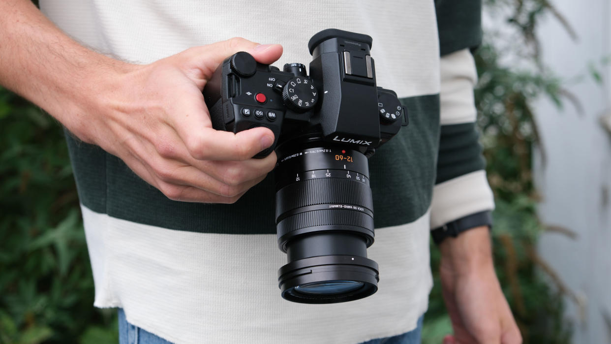  Panasonic Lumix G9 II camera in a hand . 
