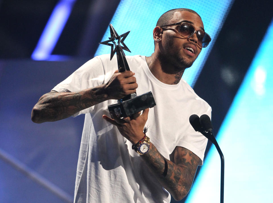 Chris Brown accepts the award for best male R& B at the BET Awards on Sunday, July 1, 2012, in Los Angeles. (Photo by Matt Sayles/Invision/AP)