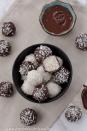 <p>Dark chocolate and coconut combine to give these decadent treats a striking black-and-white presentation that's great for serving to a holiday crowd or gifting as edible presents. They’re vegan, paleo, and sugar-free — plus, they take just a few minutes to pull together.</p><p><em><a href="https://cinnamonandcoriander.com/en/vegane-kokos-pralinen-bounty-raffaello-zuckerfrei-gluten-frei-paleo/" rel="nofollow noopener" target="_blank" data-ylk="slk:Get the recipe from Cinnamon and Coriander »;elm:context_link;itc:0;sec:content-canvas" class="link ">Get the recipe from Cinnamon and Coriander »</a></em> </p>