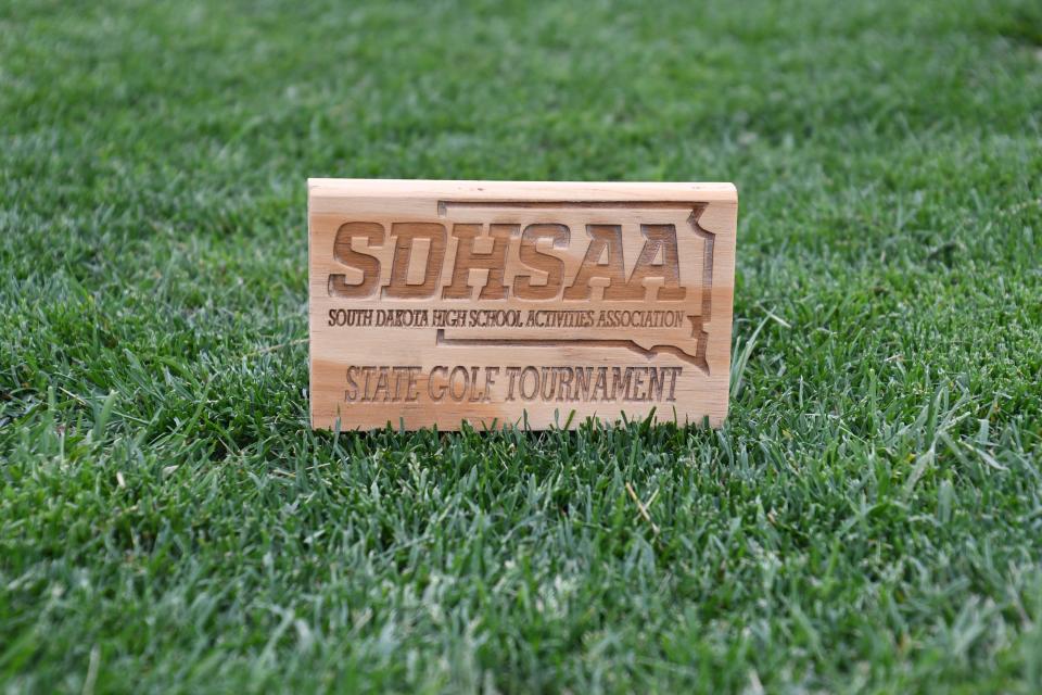 The SDHSAA's logo in the grass at the girls Class A state golf tournament on Monday, June 6 in Sioux Falls.