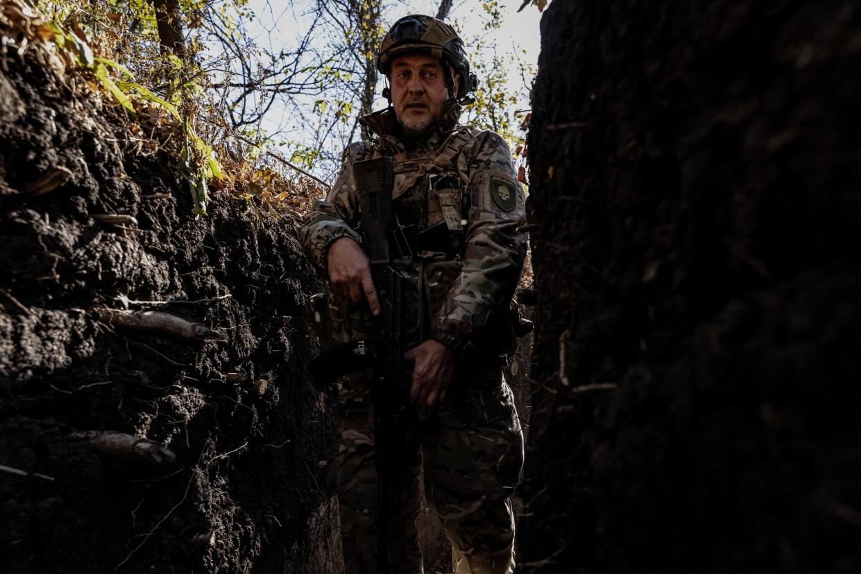 A Ukrainian serviceman walks in a trench at a position near a frontline in the Donetsk region (REUTERS)