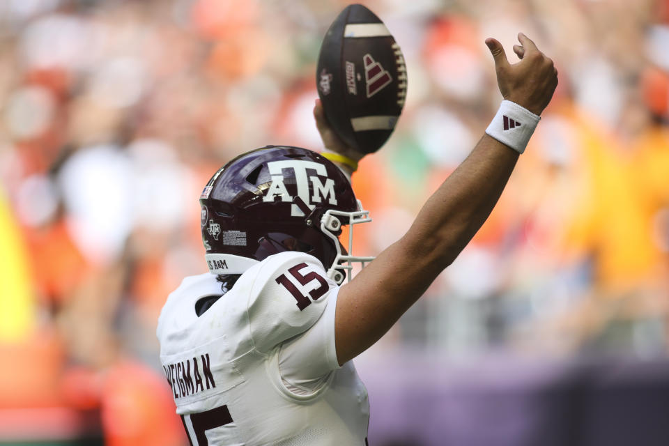 Sep 9, 2023; Miami Gardens, Florida; Texas A&M Aggies quarterback Conner Weigman (15) reacts after scoring a touchdown against the Miami Hurricanes during the first quarter at Hard Rock Stadium. Sam Navarro-USA TODAY Sports
