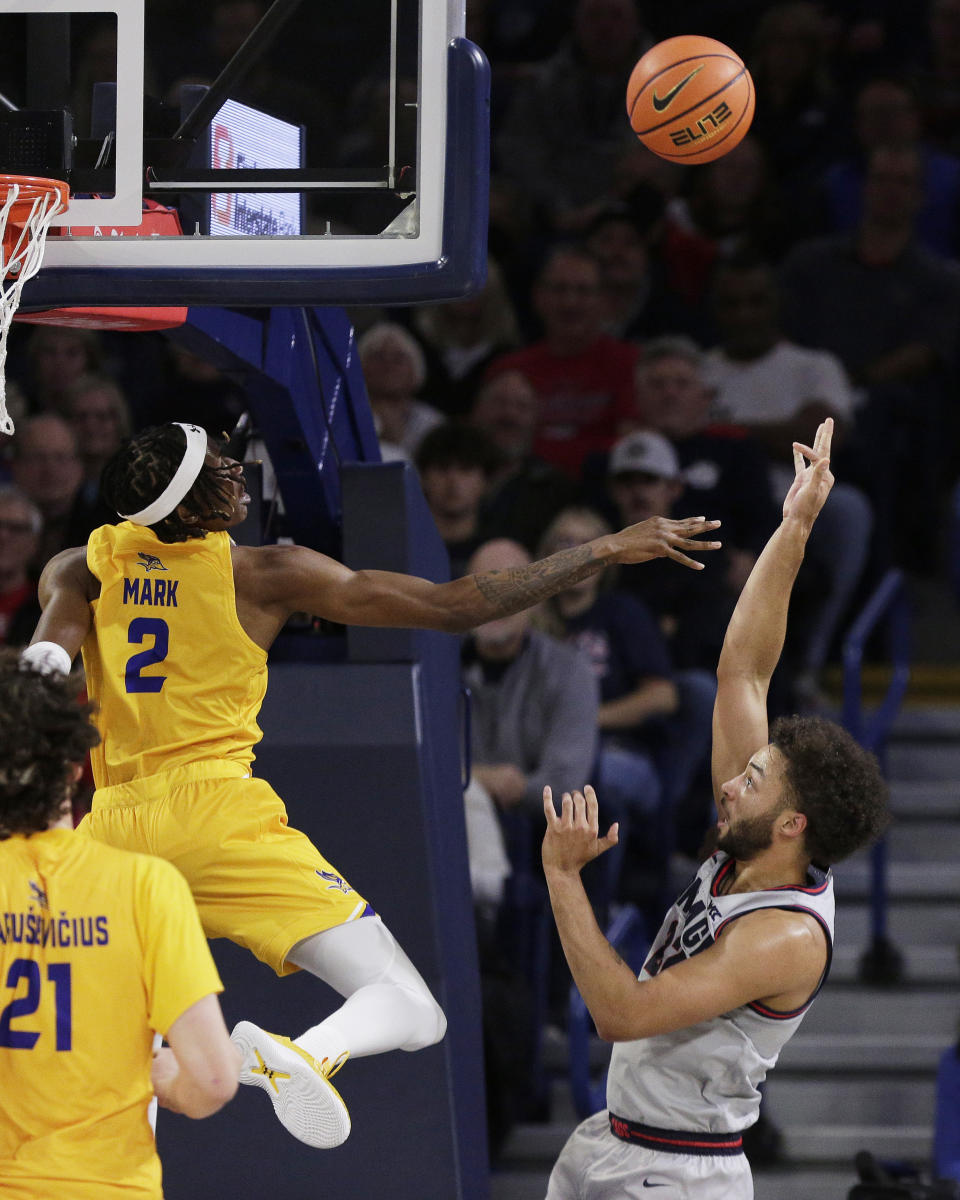 Gonzaga forward Anton Watson, right, shoots while pressured by Cal State Bakersfield forward Tom Mark (2) during the first half of an NCAA college basketball game, Tuesday, Nov. 28, 2023, in Spokane, Wash. (AP Photo/Young Kwak)