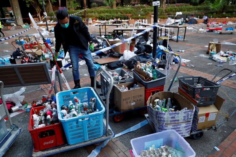 A police officer gathers forensic evidence at the campus of the Polytechnic University (PolyU) in Hong Kong