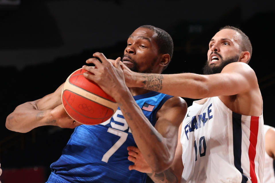 Tokyo, Japan, Sunday, July 25, 2021 - TTeam France shooting guard Evan Fournier (10) knocks the ball from Team United States forward Kevin Durant (7) in the second half at Saitama Super Arena.  (Robert Gauthier/Los Angeles Times via Getty Images)