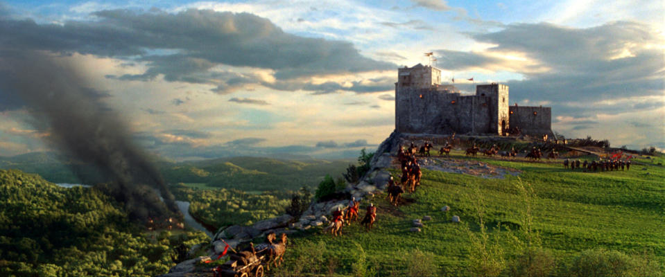people traveling to a castle