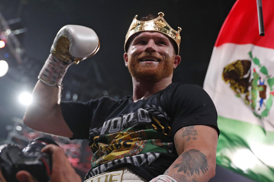 Canelo Alvarez, of Mexico, celebrates after defeating Caleb Plant by in a super middleweight title unification fight Saturday, Nov. 6, 2021, in Las Vegas. (AP Photo/Steve Marcus)